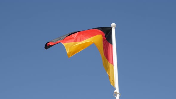 National German symbol waving in front of blue sky 4K 2160p 30fps UHD footage - Recognizable Germany