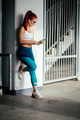 athletic girl working out and listening to music. Resting after fitness training - PhotoDune Item for Sale
