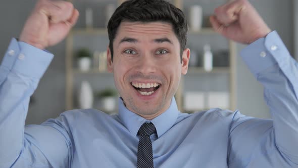 Portrait of Young Man Celebrating Success