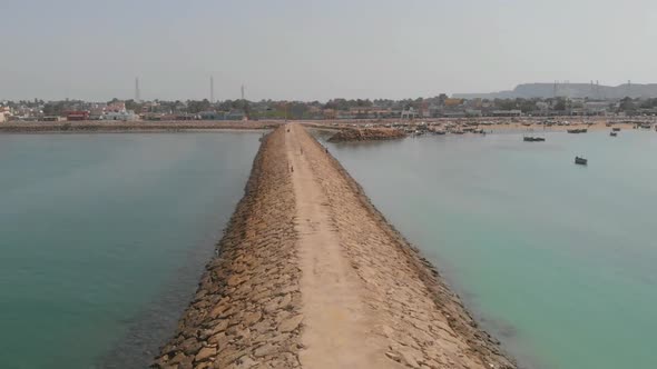 Aerial forward shot of beautiful empty Coastal Highway along Pakistan's Arabian Sea coast from Karac