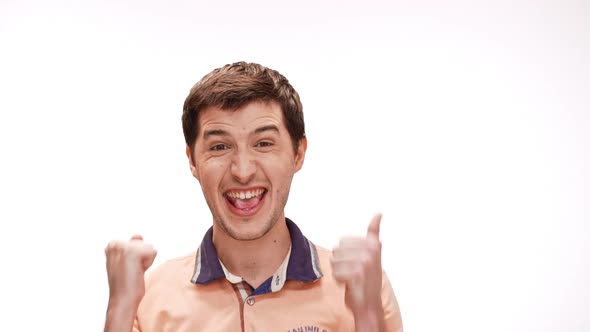 Young Handsome Man Smiling Rejoicing Over White Background Slow Motion