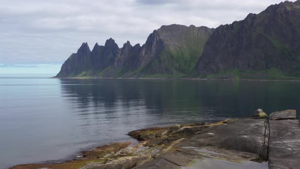 Popular travel destination and Rock Davil’s Jaw in the sunny summer day, Norway,island Senja