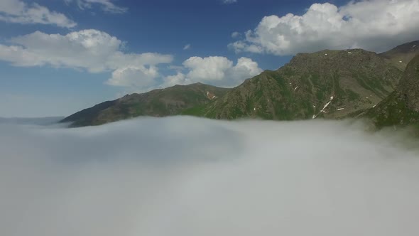 Rising Above The Clouds in Wide Valley