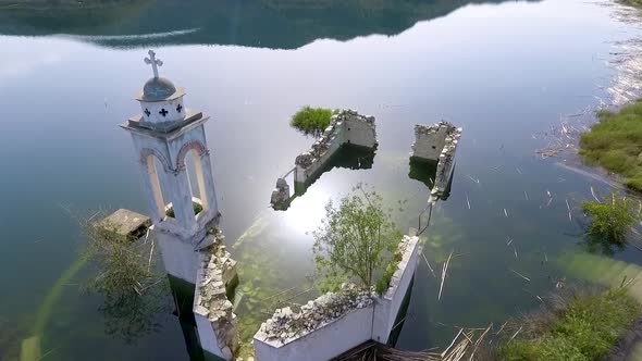 Abandoned old church immersed under reservoir water in Cyprus