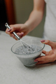Woman Mixing Chia Pudding in Glass Bowl in Kitchen - PhotoDune Item for Sale
