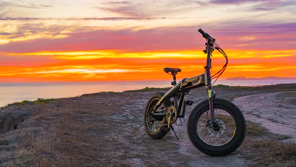 Time Lapse: Amazing sunset and bicycle in the foreground