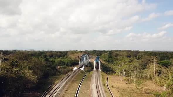 Drone flying towards double railroad bridges in Yogyakarta, Java, Indonesia.