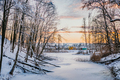 Frozen River By Bare Trees Against Sky - PhotoDune Item for Sale