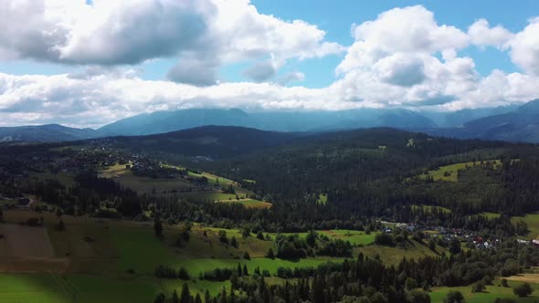 Flight Over a Mountain Cottage Village in Poland, Zakopany, Tatra National Park Aerial 4K Video