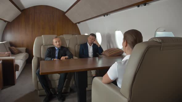 Premium View of Businesspeople Have Meeting in Corporate Aircraft