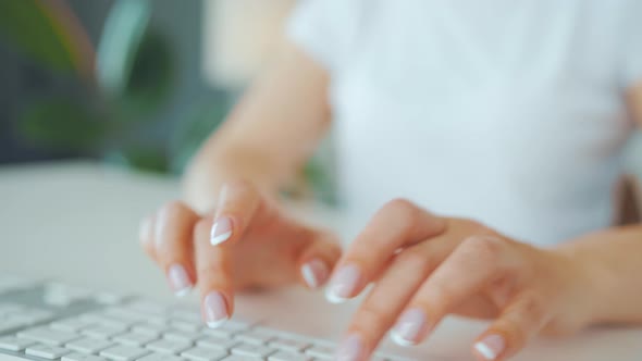 Female Hands Typing on a Computer Keyboard