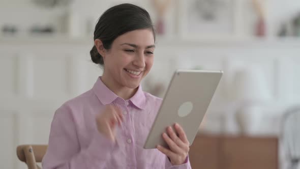 Portrait of Video Call on Tablet by Indian Woman in Office