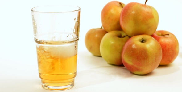 Pouring Apple Juice Into Glass