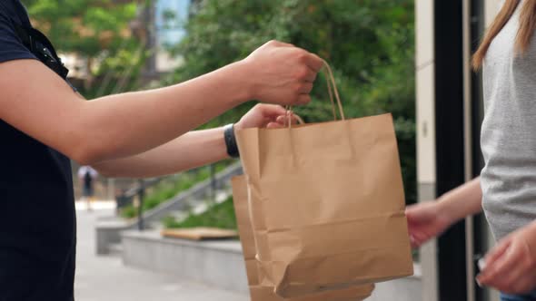 Close Up Deliveryman Worker Employee Delivers Lunch to Client