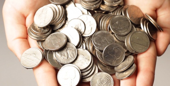 Female With Handful Of Dollar Coins