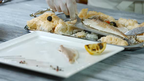 Spatula Putting Fish Onto Plate.