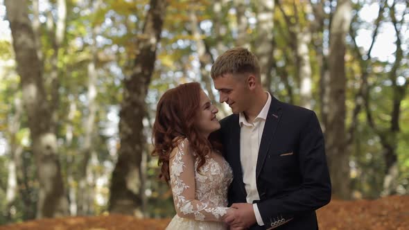 Groom with Bride in the Forest Park. Wedding Couple. Happy Family