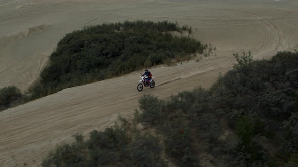 Enduro Motorcycle Rides Offroad on the Sands