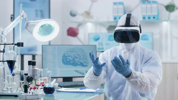 Researcher or Scientist Is Using Virtual Reality Through VR Headset alt