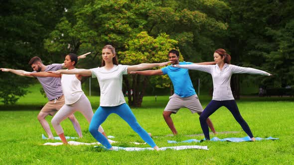 Group of People Doing Yoga at Summer Park