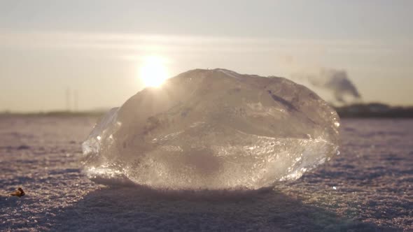 block of ice. frozen river. winter. close-up. sunset.