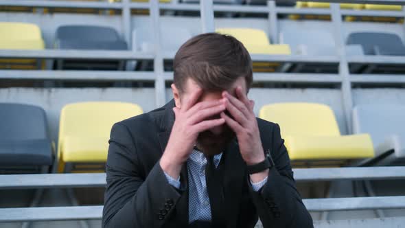 Depressed Young Man with Problems at Work