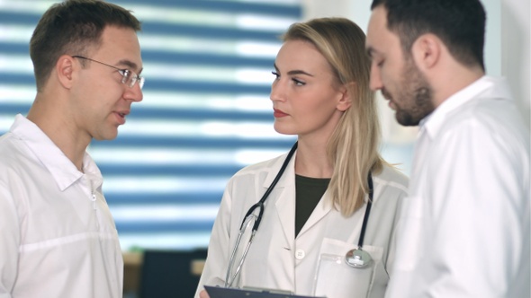 Group of doctors having medical discussion