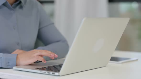 Close Up of African Woman Working on Laptop