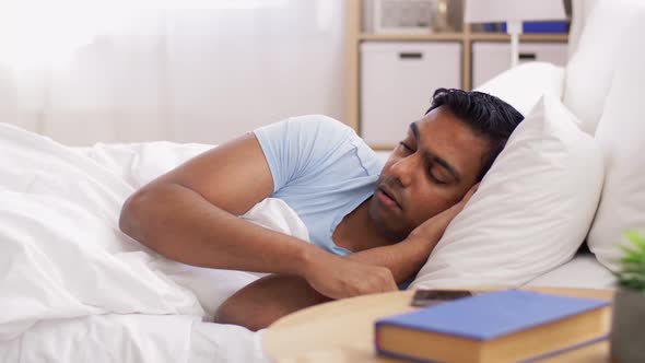 Indian Man Sleeping in Bed at Home