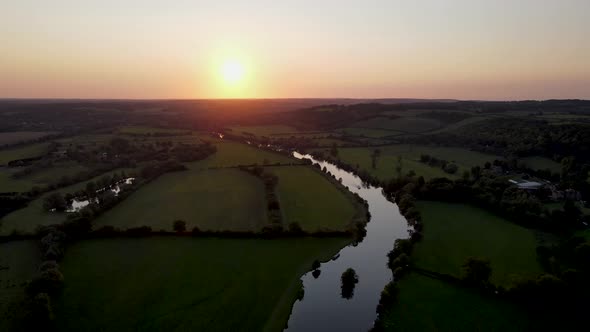 River Thames and golden sunset at Mapledurham in UK. Aerial drone view