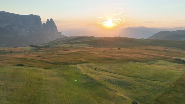 Sunrise in the Dolomites mountains with fog and mist.