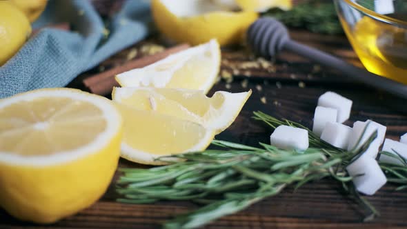 Lemon with Rosemary and Sugar Cubes on Rustic Boards