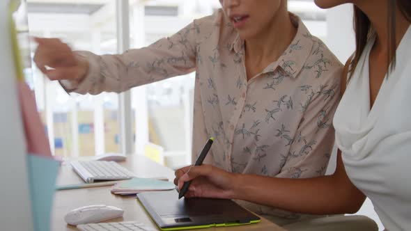 Young women working in a creative office