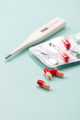 Antibiotic and thermometer. Highly blurred background photo. - PhotoDune Item for Sale