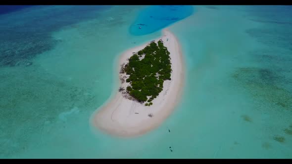 Aerial above landscape of luxury tourist beach time by shallow sea with bright sand background of a 