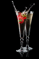 Two glasses of sparkling wine (champagne) with splash and strawberry - PhotoDune Item for Sale