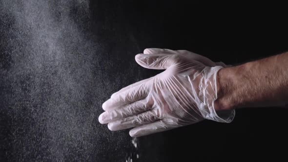 Close Up Of A Chef Wiping Flour From Hand