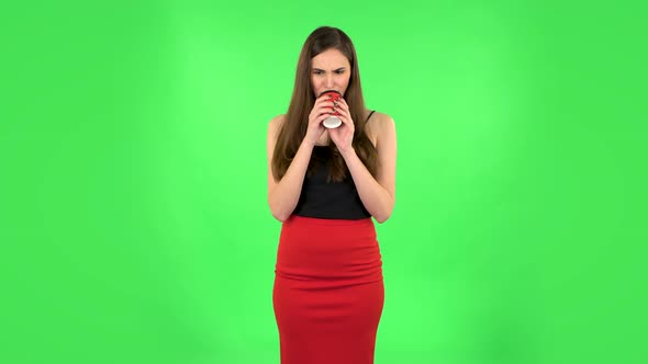 Girl Drinks Unpalatable Coffee and Is Disgusted on Green Screen