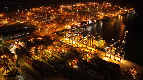 Aerial footage of Yantian container terminal at night in Shenzhen city, China, Hyperlapse alt