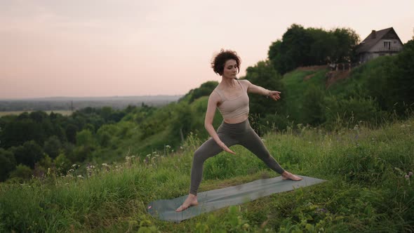 A Yoga Master Does Exercises for Balance and Stretching