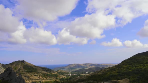 Mountains Against the Blue Sky with White Clouds