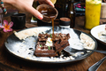 Pouring maple syrup on chocolate waffle - PhotoDune Item for Sale