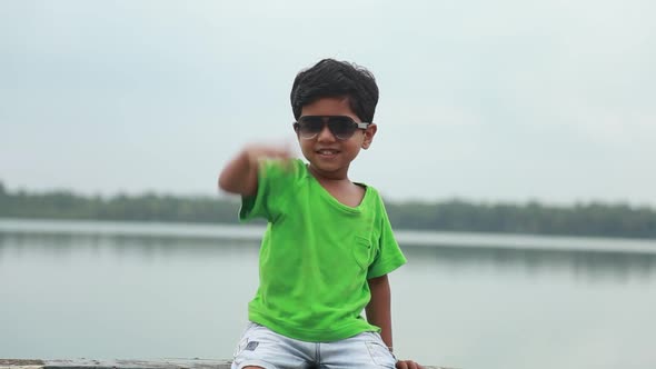 Cheerful face Young Asian boy, face cheerful,Park Little boy,Green