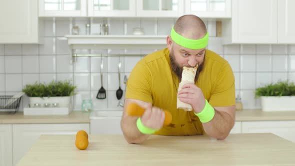 Fat Man Eating Danar Sitting at Table and Doing Exercise for Hand with Dumbbell