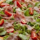 Delicious Pizza with Prosciutto Parma Ham Arugula Salad Rocket and Cherry Tomato on Rusty Dark - VideoHive Item for Sale