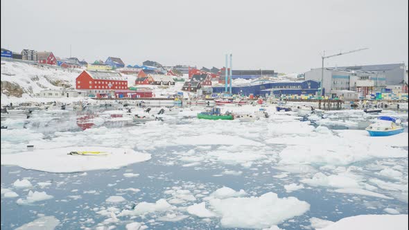 Snow And Ice Covered Harbour And Town Of Ilulissat