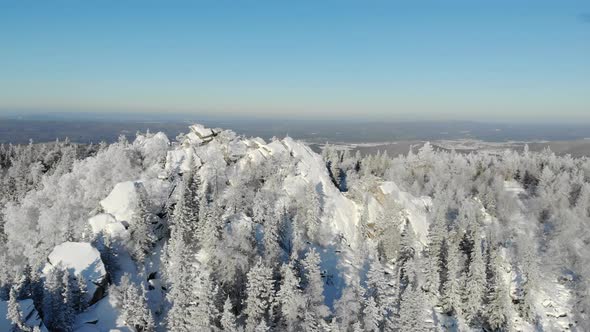 Aerial View of Snowcapped Mountain Peak in Winter