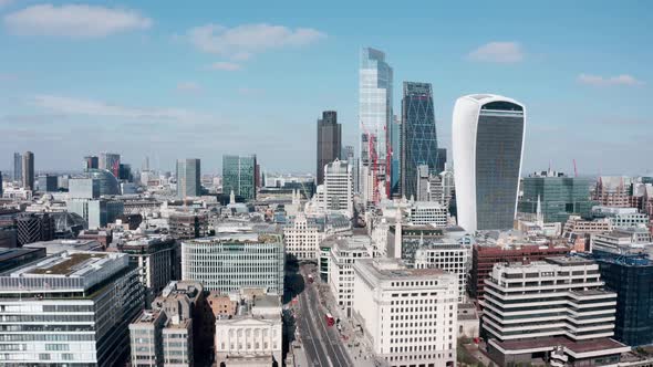 Descending drone shot from City of London skyscrapers to London bridge