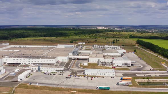 Modern technology manufacturing plant. Drone view of manufacturing area in field