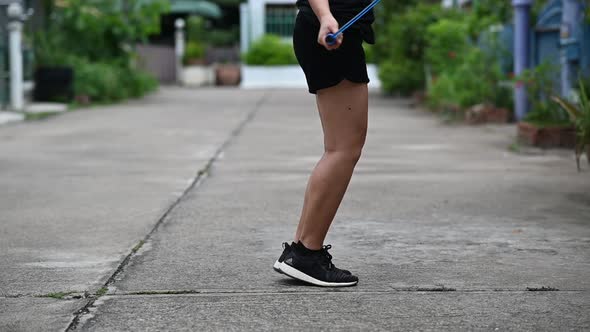 Young women exercise by skipping rope.slow motion footage.